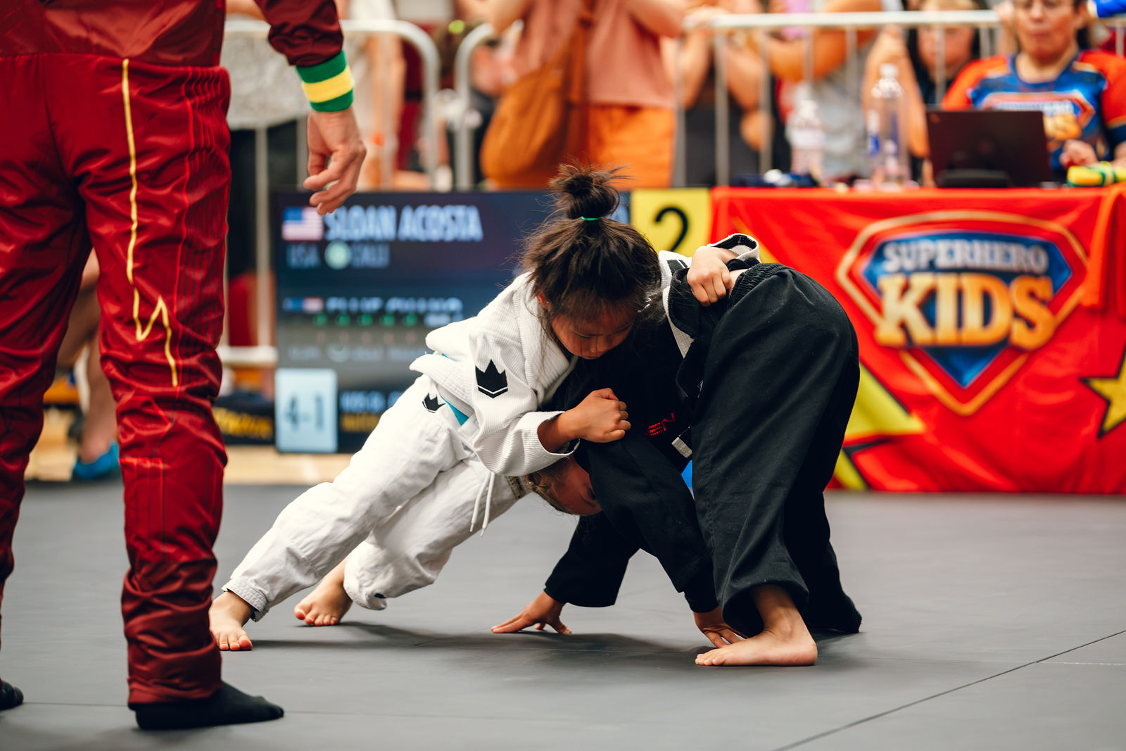 Two young athletes battling for guard position at Superhero Kids Nampa