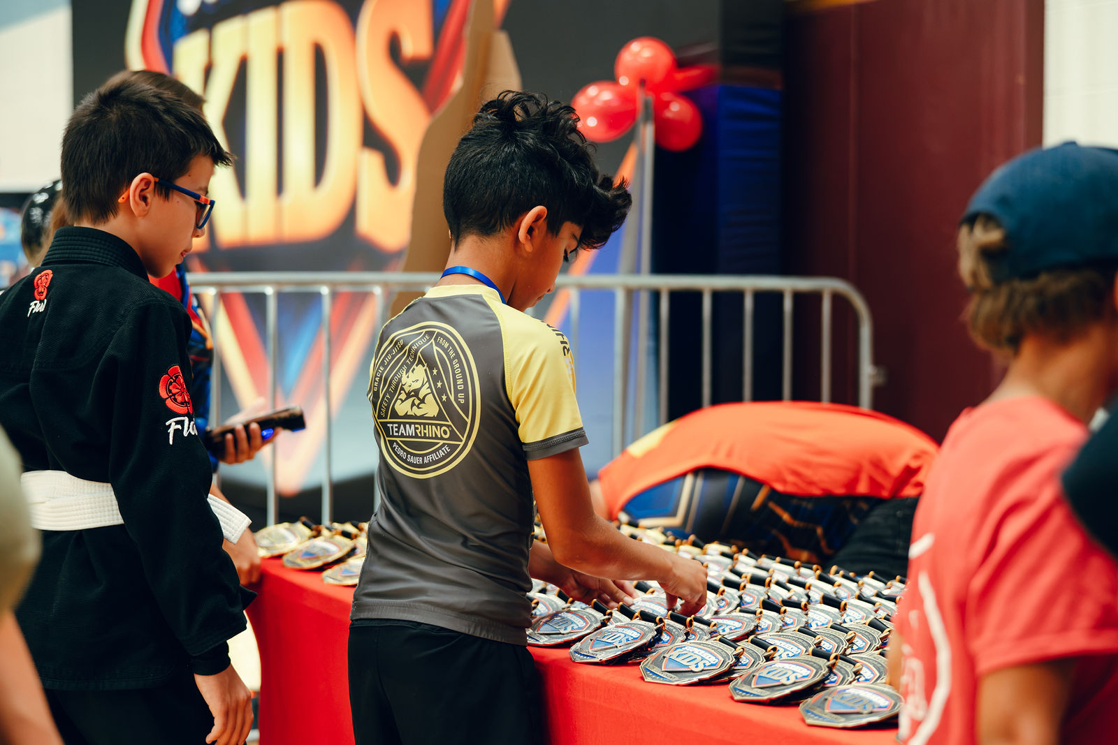 Championship medals lined up before the ceremony at Superhero Kids Nampa